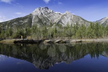 Reflective Mount Lorette Pond in the Kananaskis Country, Alberta, Canada.