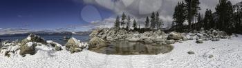 Wintry snow-covered boulders at Sand Harbor, Lake Tahoe, California, USA.