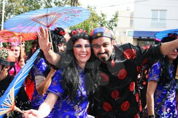 Royalty Free Photo of People Wearing Costumes in a Parade