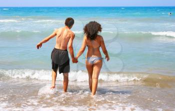 Royalty Free Photo of a Couple Walking to the Sea