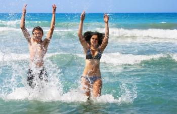 Royalty Free Photo of a Couple Having Fun in the Sea