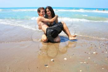 Royalty Free Photo of a Teen Couple on the Beach