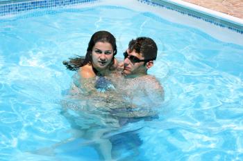Royalty Free Photo of a Couple Swimming in a Pool