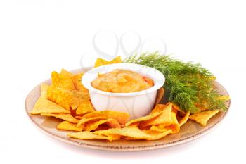 Nachos and cheese sauce isolated on white background.