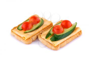 Rusk sandwiches with tomato, cucumber and cheese isolated on white background.