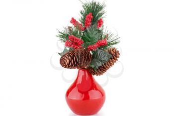 Christmas decoration in red vase isolated on white background.