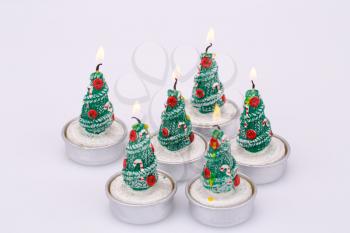Christmas candles  isolated on gray background.