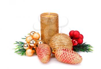 Christmas candle, balls and  fir tree branches isolated on white background.