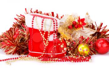 Christmas decoration with Santa's red boot, garland, balls, beads isolated on white background.