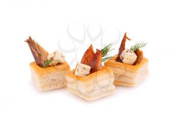 Smoked fish  and feta cheese in pastries isolated on white background.