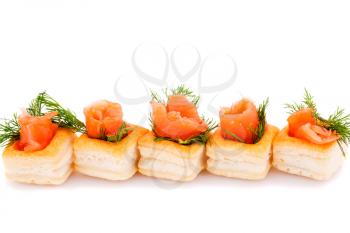 Salmon rolled fillet in pastries isolated on white background.