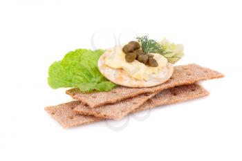 Crackers with fresh vegetables and butter isolated on white background.