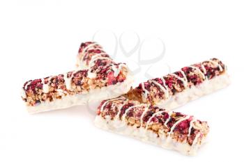 Cereal bars with different berries and seeds isolated on white background.