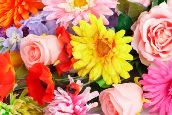 Colorful fabric flowers closeup picture.