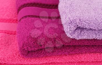 Colorful towels stack closeup picture.