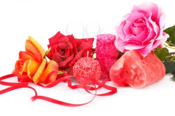 Candles and roses  isolated on white background.