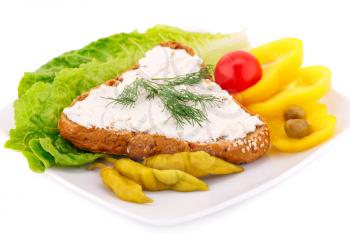 Sandwich with cheese and dill, fresh vegetables on plate.