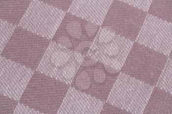 Checkered tablecloth texture as a background, closeup picture.