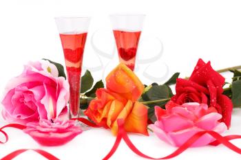 Two glasses, candles and roses  isolated on white background.