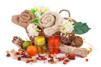 Spa set with towels, candles and flowers isolated on white background.