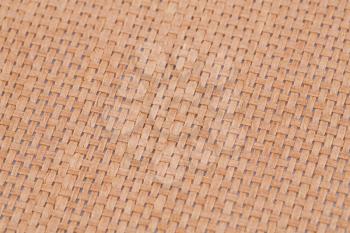Rattan placemat texture for background, close-up image.