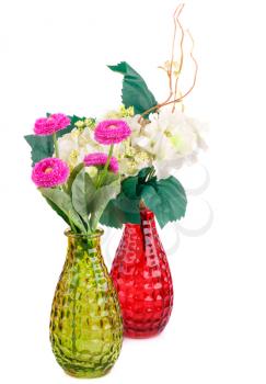 Pink and white fabric flowers in vases isolated on white background.