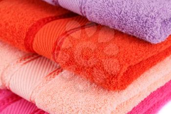 Colorful towels stack closeup picture.