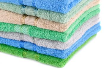 Colorful towels stack closeup picture.