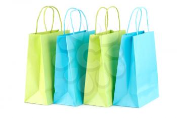 Green and blue shopping bags isolated on white background.
