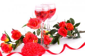 Colorful roses, candles and ribbon on white background.