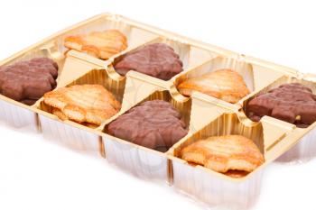 Cookies in plastic box on white background.