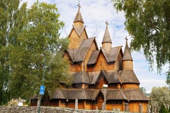 Old Heddal Stave church and cemetery in Norwegian village.