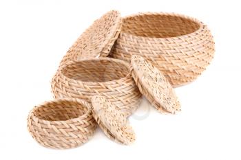 Three wicker boxes isolated on white background.