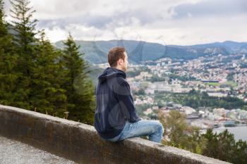 The young man on the top view point of Bergen city in Norway.