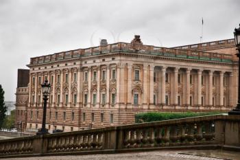 View from the Royal Palace to the Riksdag Parliament Building in Stockholm, Sweden, rainy day.