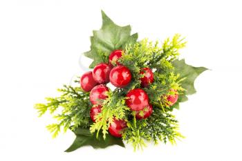 Christmas decoration with holly berries isolated on white background.