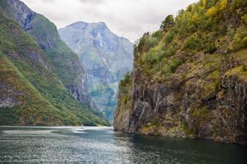Landscape with Naeroyfjord and high mountains in Norway.