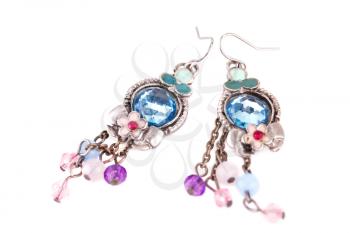 Ancient style earrings with colorful stones isolated on white background.