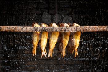 Outdoor natural smoked fish in the traditional Dutch fisherman village museum (Zuiderzeemuseum), Netherlands.