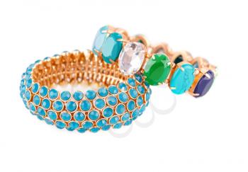 Stylish bracelets with colorful stones isolated on white background.