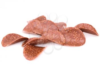 Chocolate chips isolated on white background.