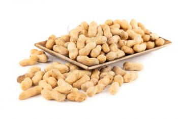 Peanuts in shell on the wooden tray isolated on white background.