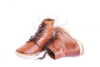 Brown stylish boots isolated on white background.
