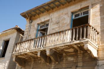 Old building with beautiful balcony in Limassol, Cyprus.