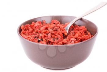 Goji berries in brown bowl isolated on white background.