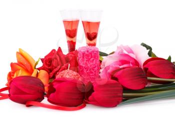 Two glasses, candles, tulips and roses  isolated on white background.