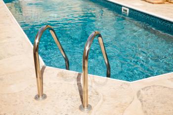 Swimming pool with mosaic pattern.