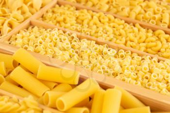 Various kind of Italian pasta in the wooden box.