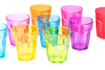 Colorful plastic glasses on white background.