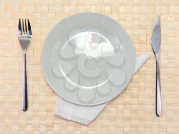 Table serving-knife,plate,fork and silk napkin  on  various colour background.